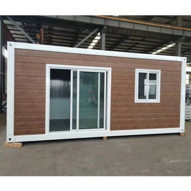 shipping container house with sliding door and wall cladding